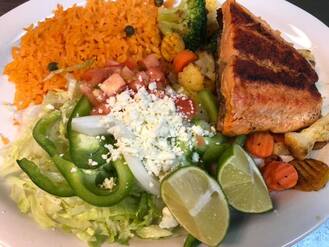 Salmon with Vegetables Grilled Salmon with Vegetables, Rice and Tossed Salad in Buffalo New York